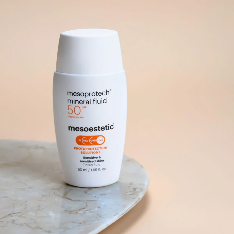 Mesoestetic mesoprotech® mineral fluid | Tonuotas mineralinė apsauga nuo saulės jautriai odai SPF50+ 50 ml